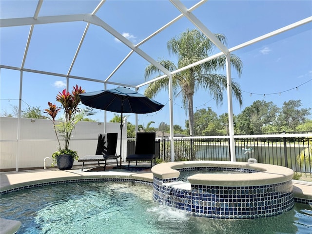view of pool with fence, a patio, central AC unit, a lanai, and a pool with connected hot tub