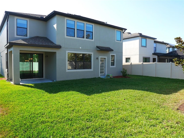 19314 Long Lake Ranch Blvd, Lutz, FL 33558 - back of property with stucco siding and a shingled roof
