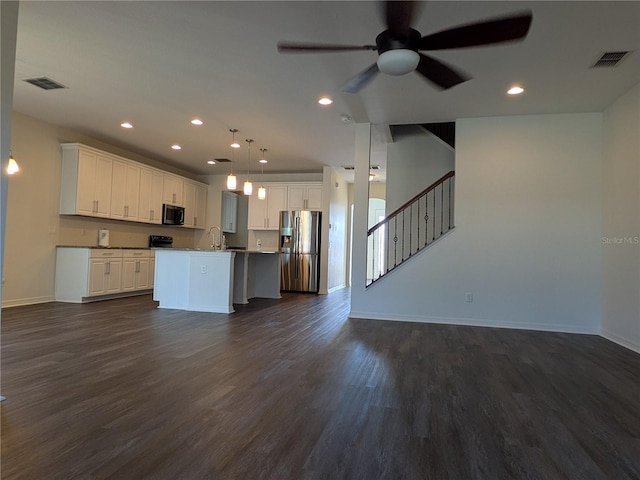 19314 Long Lake Ranch Blvd, Lutz, FL 33558 - kitchen with stainless steel fridge, open floor plan, ceiling fan, baseboards, and recessed lighting