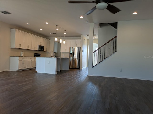 19314 Long Lake Ranch Blvd, Lutz, FL 33558 - kitchen featuring stainless steel appliances, open floor plan, ceiling fan, white cabinets, and recessed lighting
