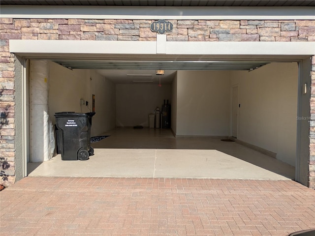 19314 Long Lake Ranch Blvd, Lutz, FL 33558 - garage with a garage door opener and electric water heater