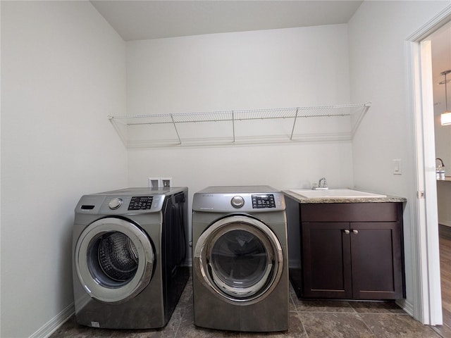 19314 Long Lake Ranch Blvd, Lutz, FL 33558 - laundry room featuring washing machine and clothes dryer, cabinet space, and baseboards