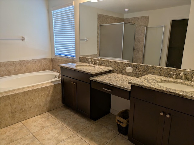19314 Long Lake Ranch Blvd, Lutz, FL 33558 - full bath featuring a shower stall, tile patterned flooring, and two vanities