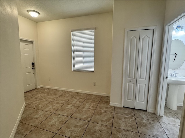 2731 Hampton Green Ln, Brandon, FL 33511 - unfurnished bedroom featuring light tile patterned floors, multiple windows, and a closet