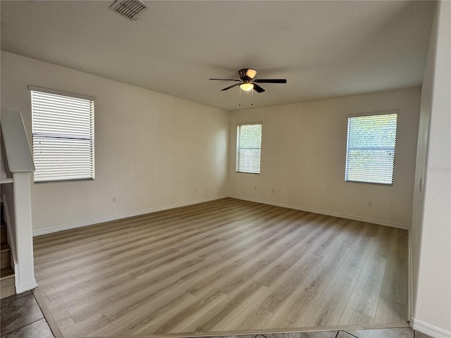 2731 Hampton Green Ln, Brandon, FL 33511 - spare room with wood finished floors and a ceiling fan