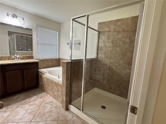 2731 Hampton Green Ln, Brandon, FL 33511 - bathroom with a garden tub, a stall shower, vanity, and a textured ceiling