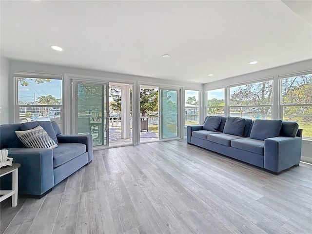 living room with recessed lighting and light wood finished floors
