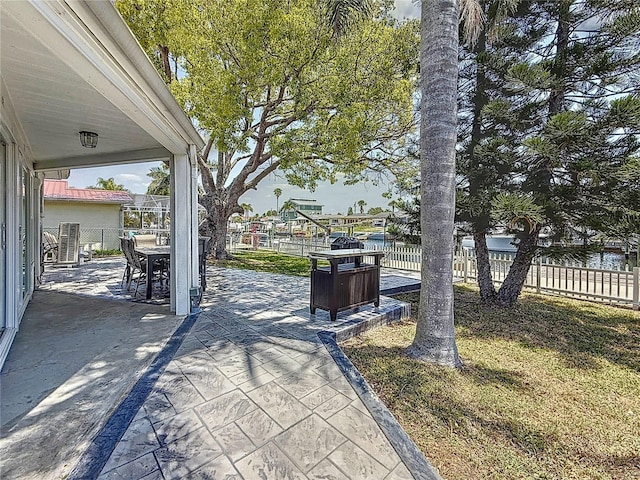 view of patio with fence and outdoor dining space