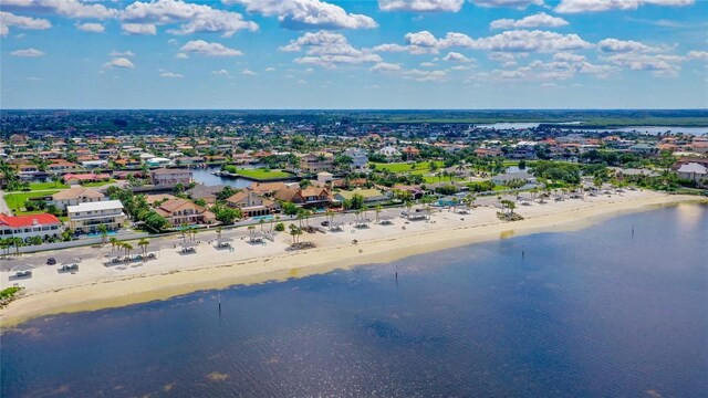 aerial view featuring a residential view, a beach view, and a water view