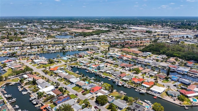 drone / aerial view with a residential view and a water view
