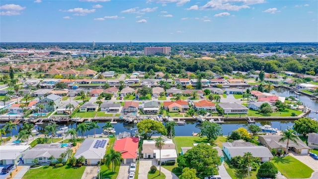 aerial view with a water view and a residential view