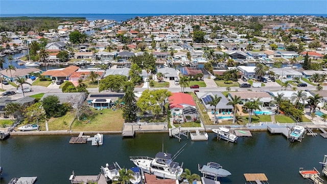 birds eye view of property featuring a residential view and a water view