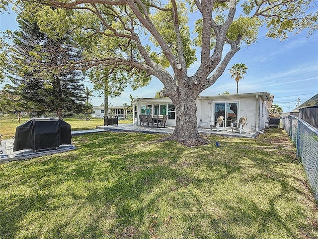 view of yard with a patio and a fenced backyard