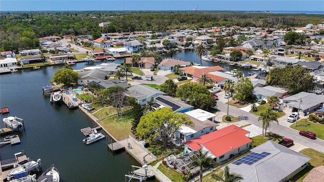bird's eye view with a water view and a residential view