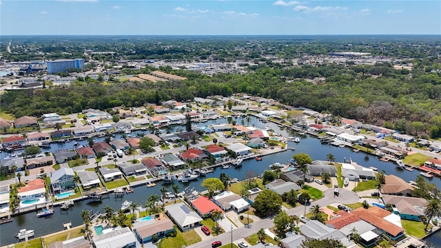 drone / aerial view featuring a water view and a residential view