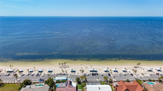 drone / aerial view with a beach view and a water view