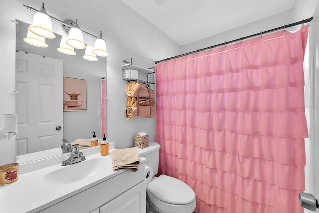 full bath with vanity, toilet, and curtained shower