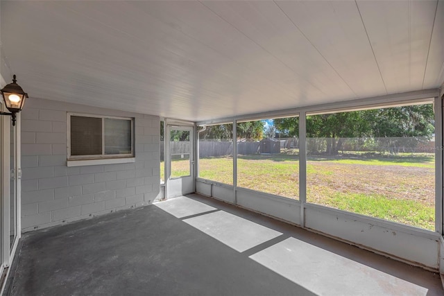 unfurnished sunroom featuring a healthy amount of sunlight