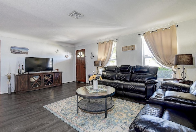 8497 137th St, Seminole, FL 33776 - living room featuring visible vents and dark wood-type flooring