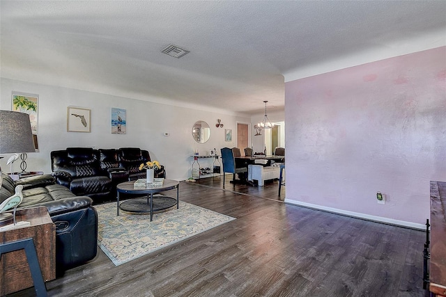 8497 137th St, Seminole, FL 33776 - living room featuring an inviting chandelier, wood finished floors, and visible vents