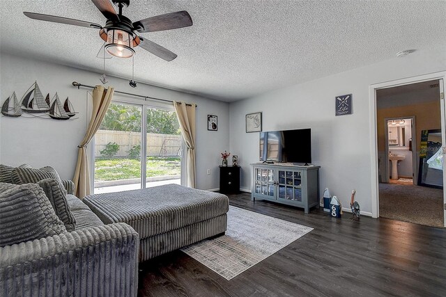 8497 137th St, Seminole, FL 33776 - living area with baseboards, a ceiling fan, a textured ceiling, and wood finished floors