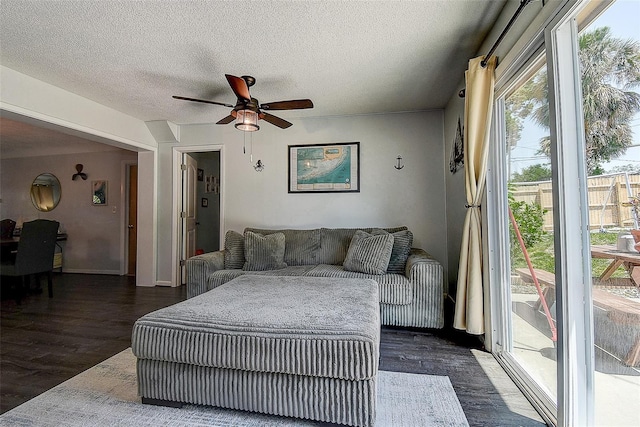 8497 137th St, Seminole, FL 33776 - living area featuring dark wood-type flooring, a ceiling fan, and a textured ceiling