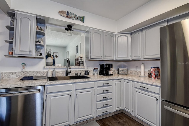 8497 137th St, Seminole, FL 33776 - kitchen with open shelves, light countertops, a sink, freestanding refrigerator, and dishwashing machine