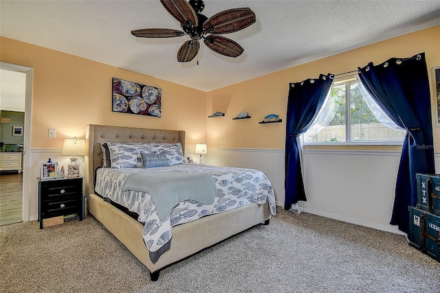 8497 137th St, Seminole, FL 33776 - carpeted bedroom with a textured ceiling, ceiling fan, and baseboards