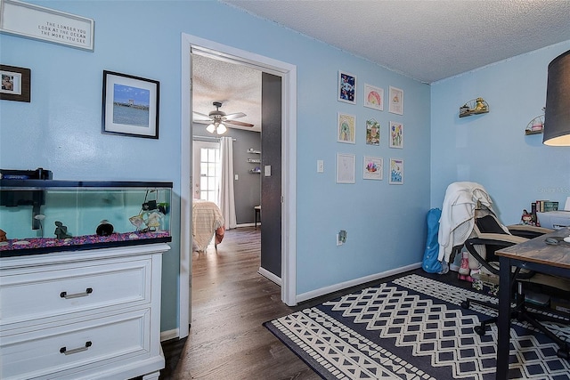8497 137th St, Seminole, FL 33776 - interior space featuring baseboards, a textured ceiling, and dark wood-style flooring