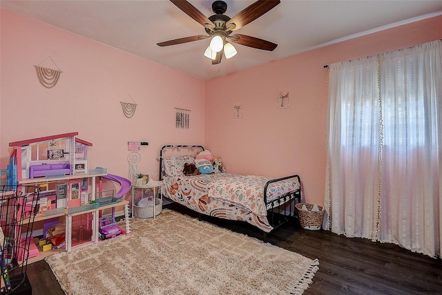 8497 137th St, Seminole, FL 33776 - bedroom with a ceiling fan and wood finished floors