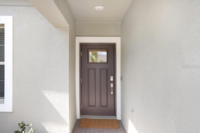 10998 Gable Dig Loop, San Antonio, FL 33576 - property entrance with stucco siding