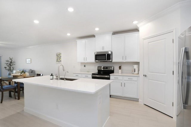 10998 Gable Dig Loop, San Antonio, FL 33576 - kitchen featuring a sink, appliances with stainless steel finishes, white cabinets, and crown molding
