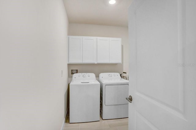 10998 Gable Dig Loop, San Antonio, FL 33576 - clothes washing area featuring independent washer and dryer and cabinet space