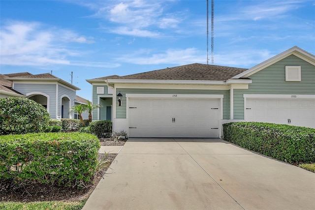 view of front of property with driveway and a garage