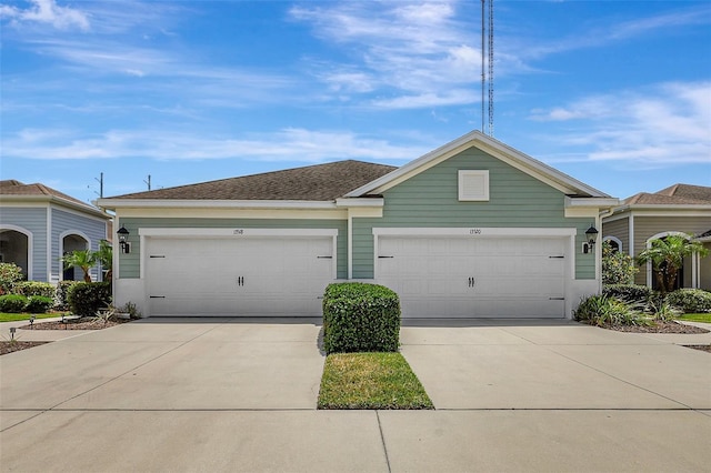 single story home with an attached garage and driveway