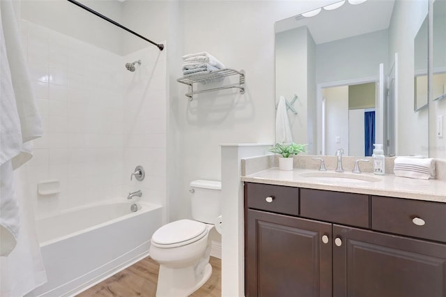 full bathroom with vanity, toilet, shower / bathing tub combination, and wood finished floors