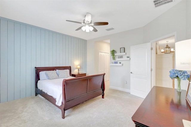 bedroom with baseboards, a ceiling fan, light colored carpet, and visible vents
