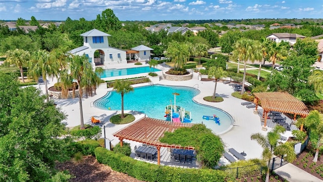 pool featuring a patio area, fence, and a pergola