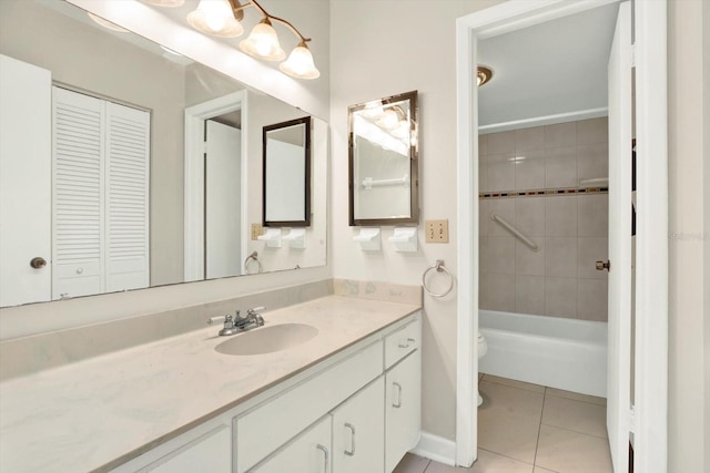 bathroom featuring tile patterned floors, vanity, a closet, toilet, and bathing tub / shower combination