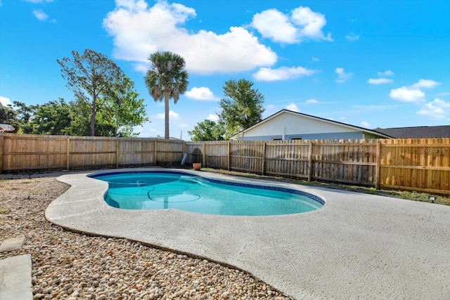 view of swimming pool with a patio, a fenced in pool, and a fenced backyard