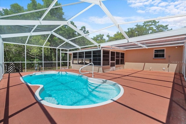 outdoor pool featuring a patio and a lanai