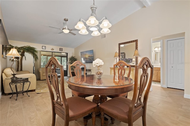 dining area featuring visible vents, light wood finished floors, ceiling fan with notable chandelier, and high vaulted ceiling