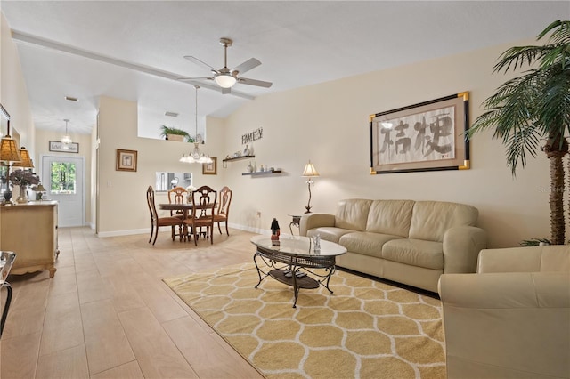 living area featuring baseboards, light wood finished floors, ceiling fan with notable chandelier, and vaulted ceiling