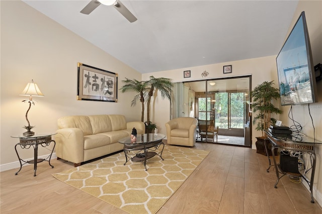 living area with ceiling fan, wood finished floors, and lofted ceiling