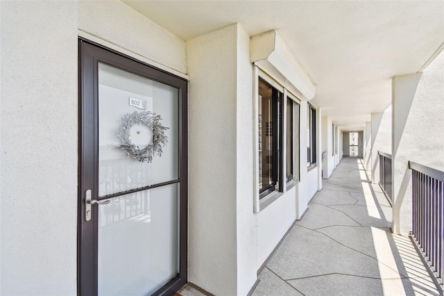 view of exterior entry with stucco siding