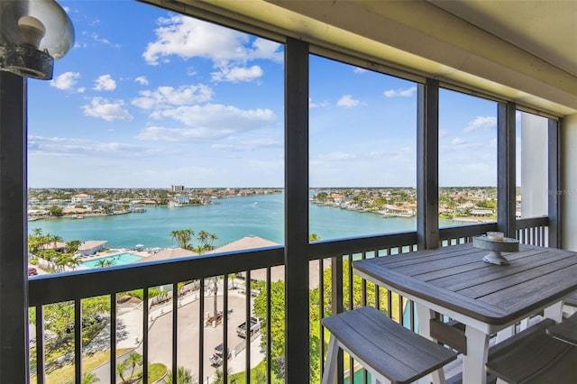 sunroom with a water view