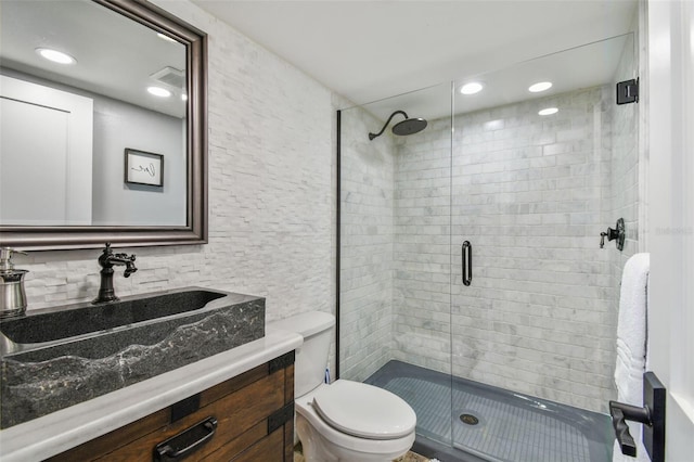 bathroom with toilet, recessed lighting, a shower stall, and vanity