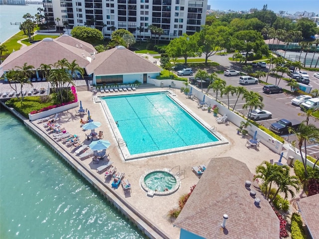 pool with fence and a water view