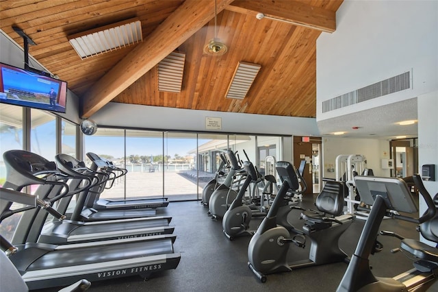 gym with high vaulted ceiling and wooden ceiling