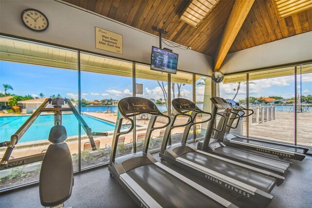 workout area with vaulted ceiling, wooden ceiling, and a wealth of natural light